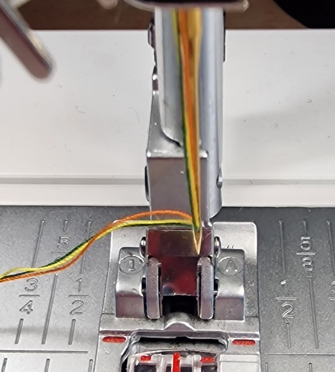 close up of a threaded swing machine needle at Eau Brink Studio