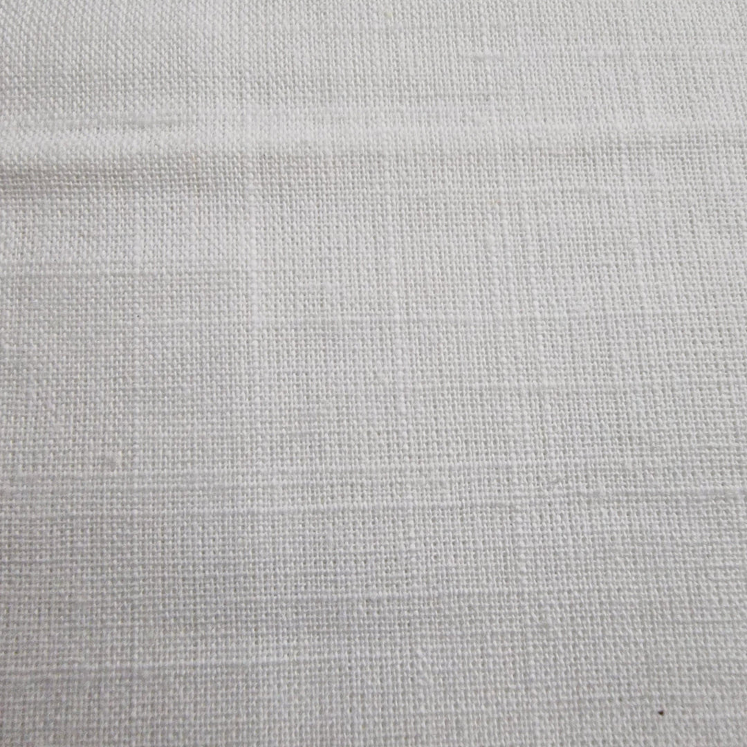 White cotton linen fabric with a textured weave pattern, viewed from above.