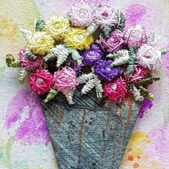 Floral brooch on a watercolor background. Workshop at Eau brink Studio