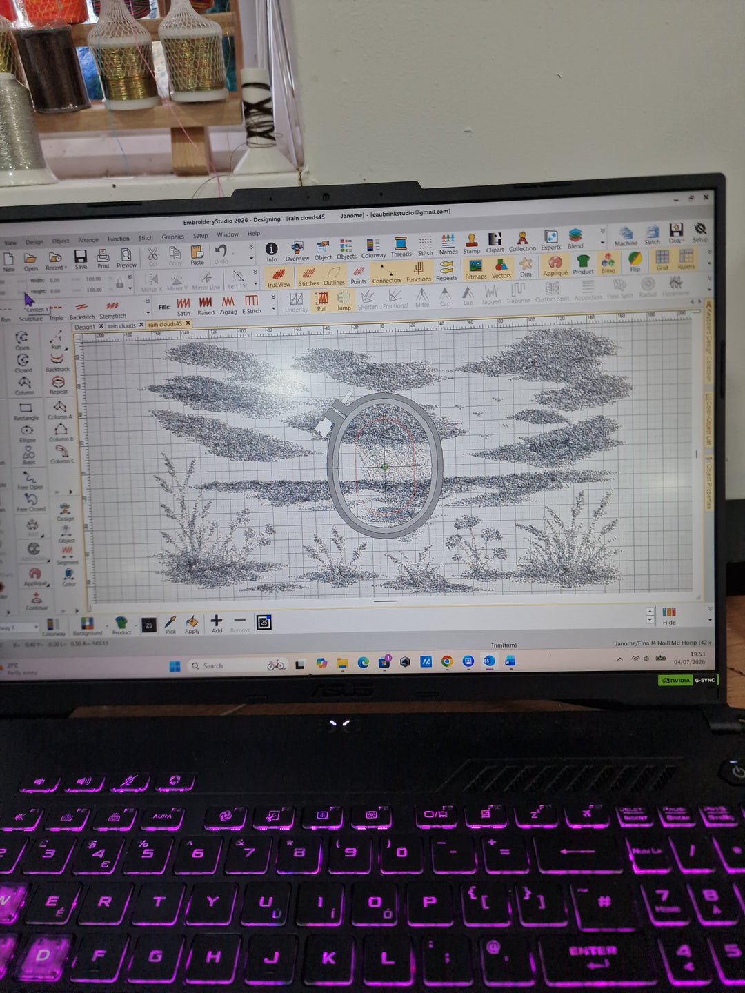 Textile artist digitising an original landscape embroidery design on embroidery software, showing the unseen design process behind running a creative textile business.