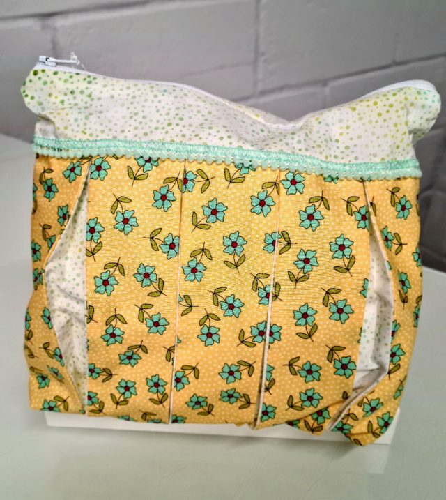 Green Flower on Yellow Background Fabric: Pleated Cosmetic Bag