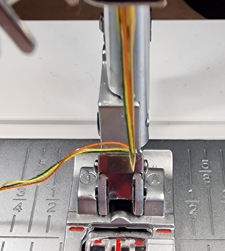 close up of a threaded swing machine needle at Eau Brink Studio