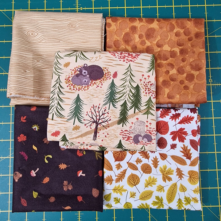 Collection of fabric swatches with various patterns on a grid background